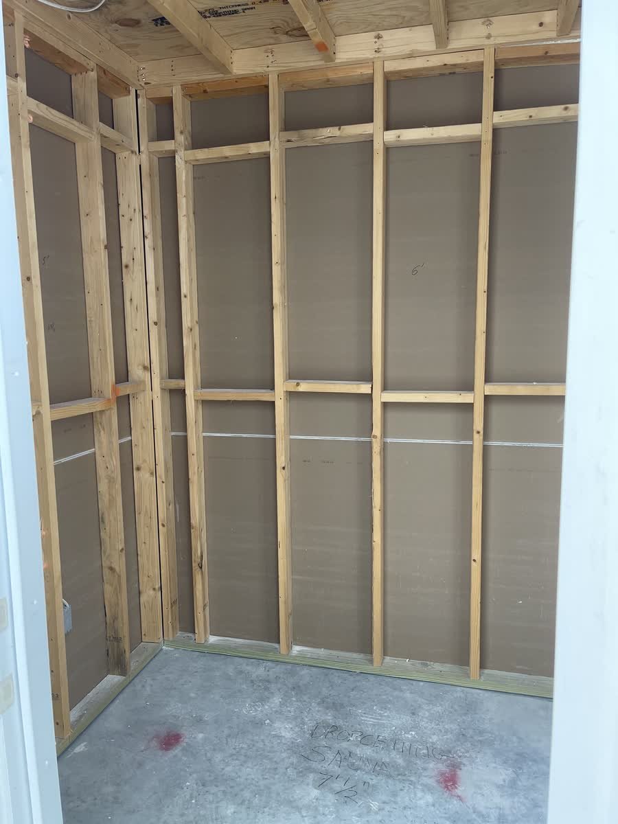 Sauna room framed with wood studs on a concrete slab