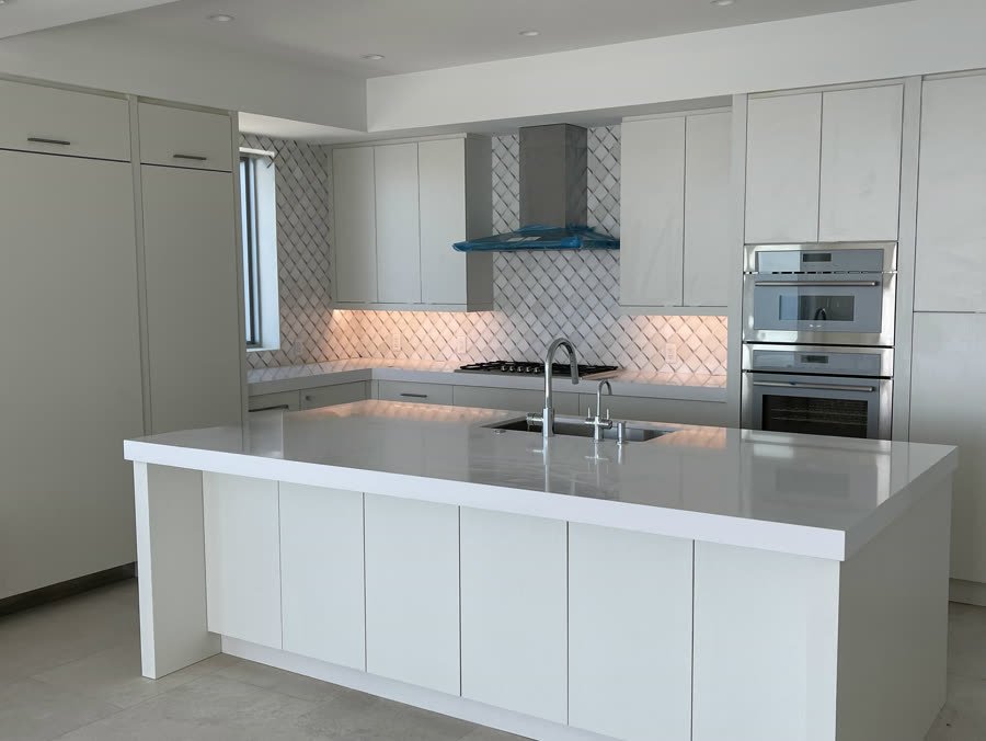 Modern kitchen with a white waterfall island